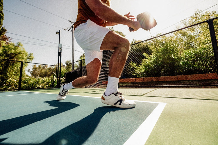 man playing pickleball in xero shoes