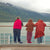 three kids on cruise deck looking at mountains