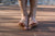 Two bare feet on boards